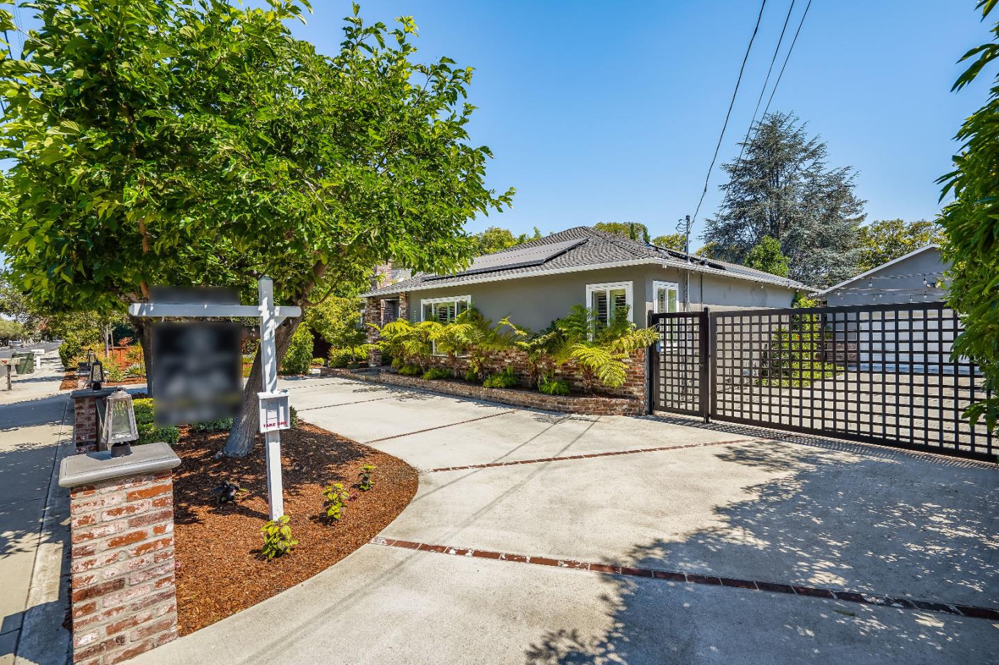 2275 Grant Road Los Altos, CA 94024 - Photo 3 of 66 a front view of a house with garden