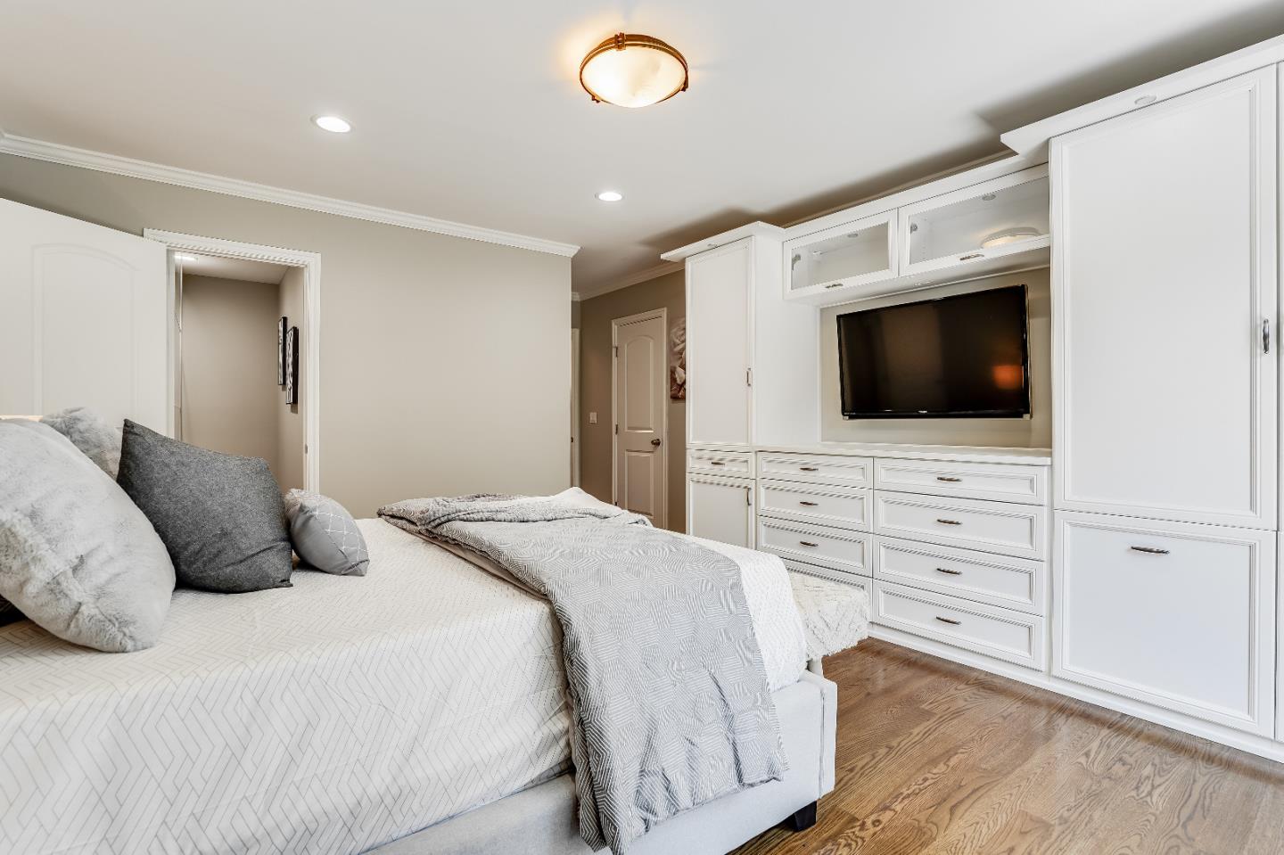 2275 Grant Road Los Altos, CA 94024 - Photo 35 of 66 a bedroom with a bed and a flat screen tv