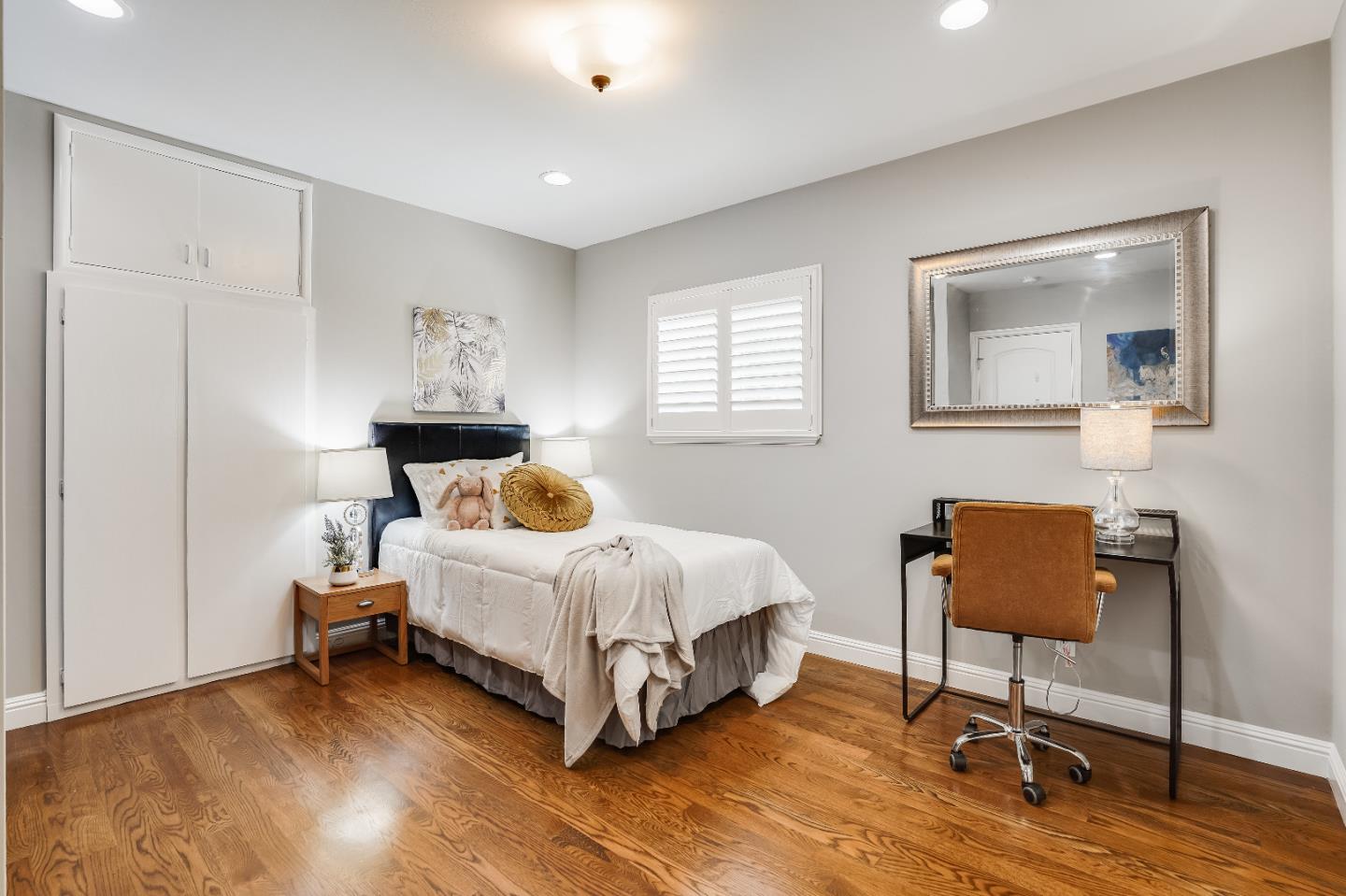 2275 Grant Road Los Altos, CA 94024 - Photo 39 of 66 a spacious bedroom with a bed and a chair