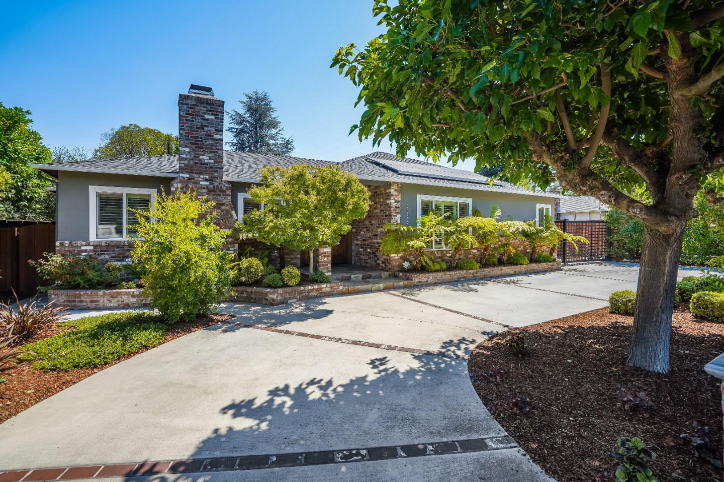 2275 Grant Road Los Altos, CA 94024 - Photo 4 of 66 a front view of a house with garden