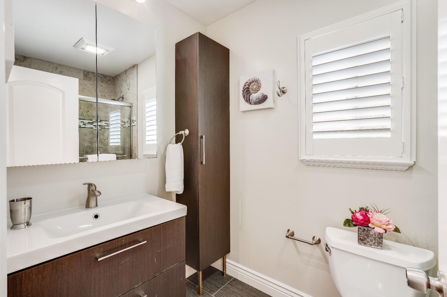 2275 Grant Road Los Altos, CA 94024 - Photo 45 of 66 a bathroom with a sink and a mirror