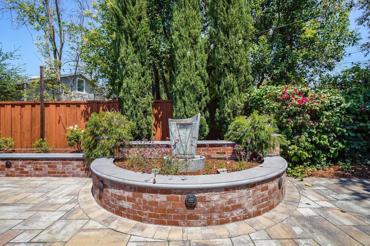 2275 Grant Road Los Altos, CA 94024 - Photo 52 of 66 a view of a fountain in the backyard of house
