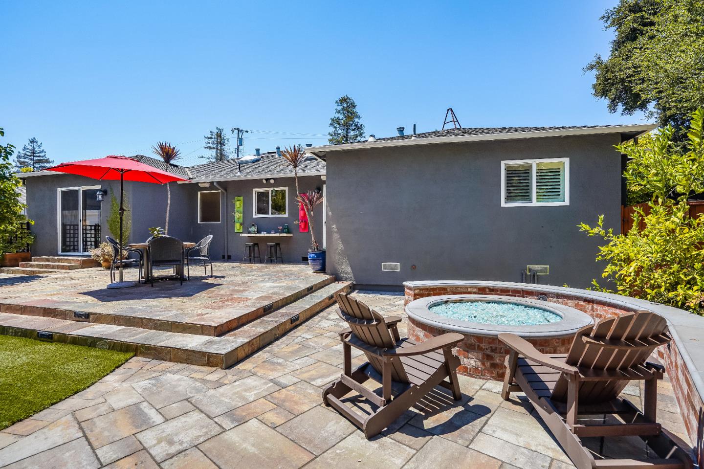 2275 Grant Road Los Altos, CA 94024 - Photo 53 of 66 a view of a patio with table and chairs under an umbrella with potted plants