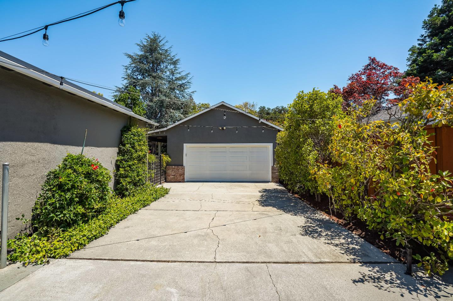 2275 Grant Road Los Altos, CA 94024 - Photo 57 of 66 a front view of a house with a yard and garage