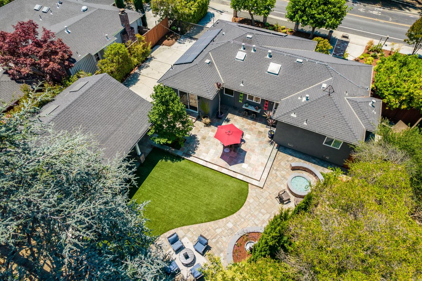 2275 Grant Road Los Altos, CA 94024 - Photo 62 of 66 an aerial view of a house with a swimming pool and a yard