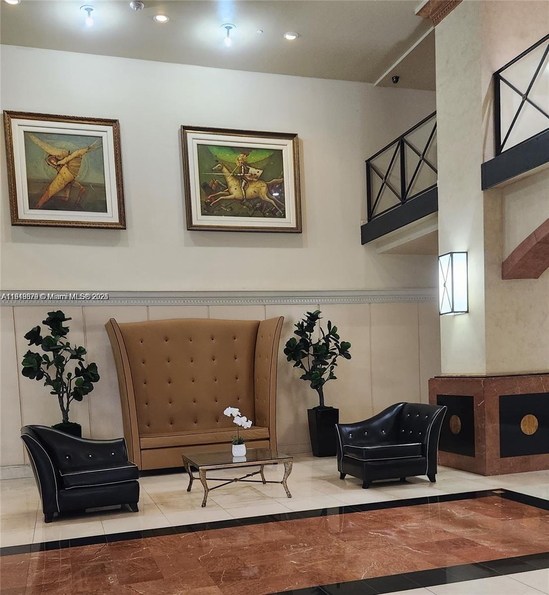 555 Northeast 15th Street, Unit 23J Miami, FL 33132 - Photo 2 of 20 a living room with furniture