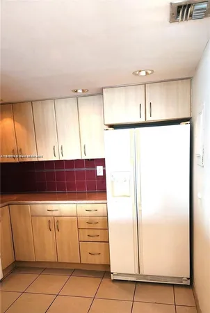 a bathroom with a shower and a sink