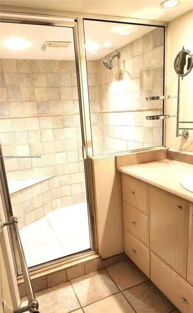 a bathroom with a bathtub and a shower