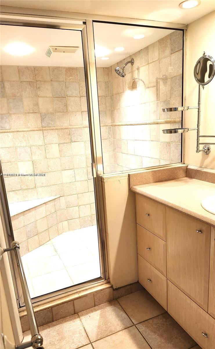 555 Northeast 15th Street, Unit 23J Miami, FL 33132 - Photo 7 of 20 a bathroom with a bathtub and a shower