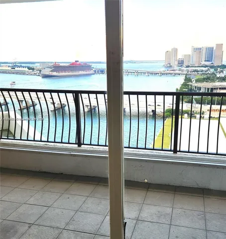 a view of a lake with tall building