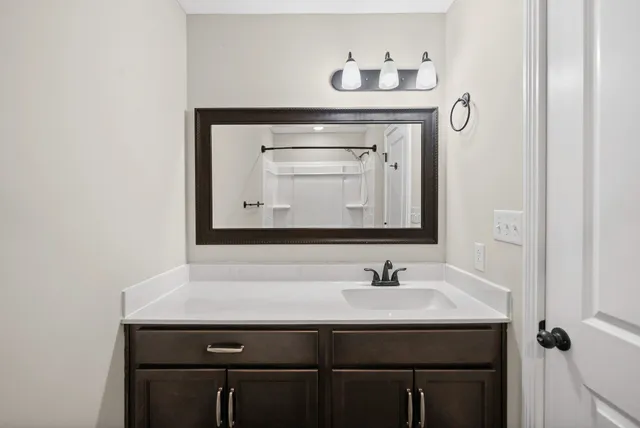 a bathroom with a sink and a mirror