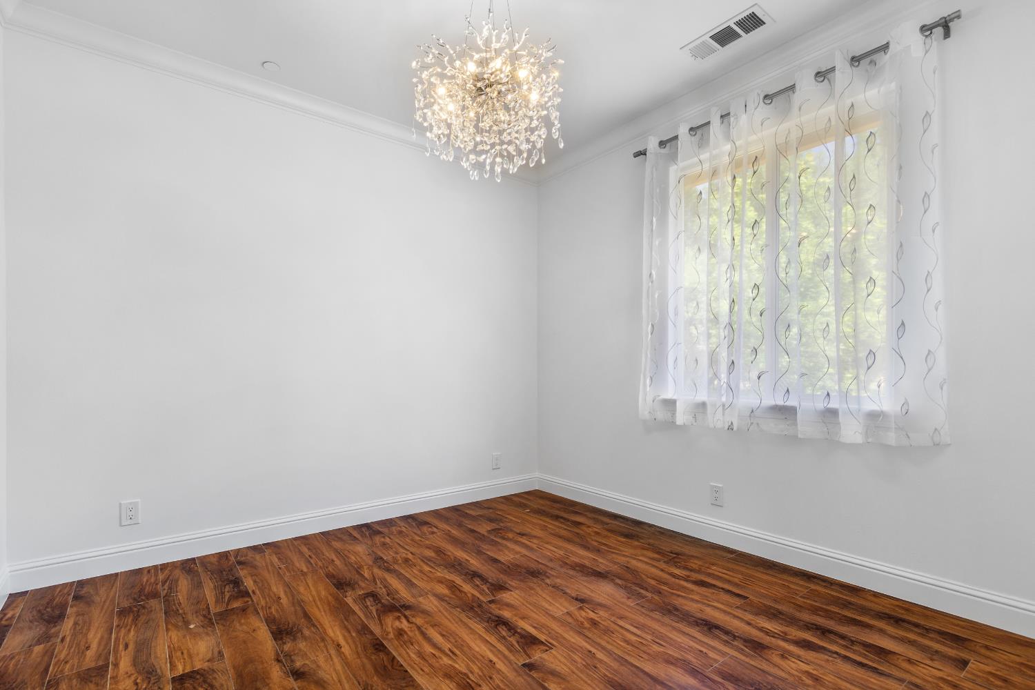 6404 Sylvan Road Citrus Heights, CA 95610 - Photo 15 of 20 wooden floor in an empty room with a window