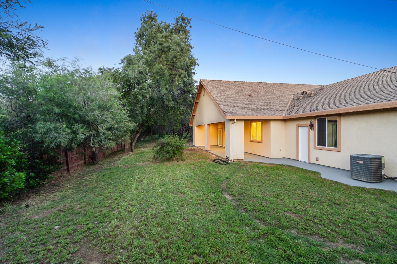 6404 Sylvan Road Citrus Heights, CA 95610 - Photo 17 of 20 a view of a house with a yard