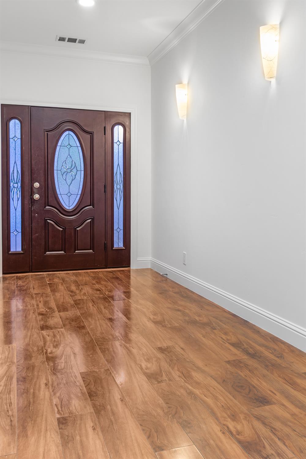 6404 Sylvan Road Citrus Heights, CA 95610 - Photo 3 of 20 a view of an empty room with wooden floor and a window