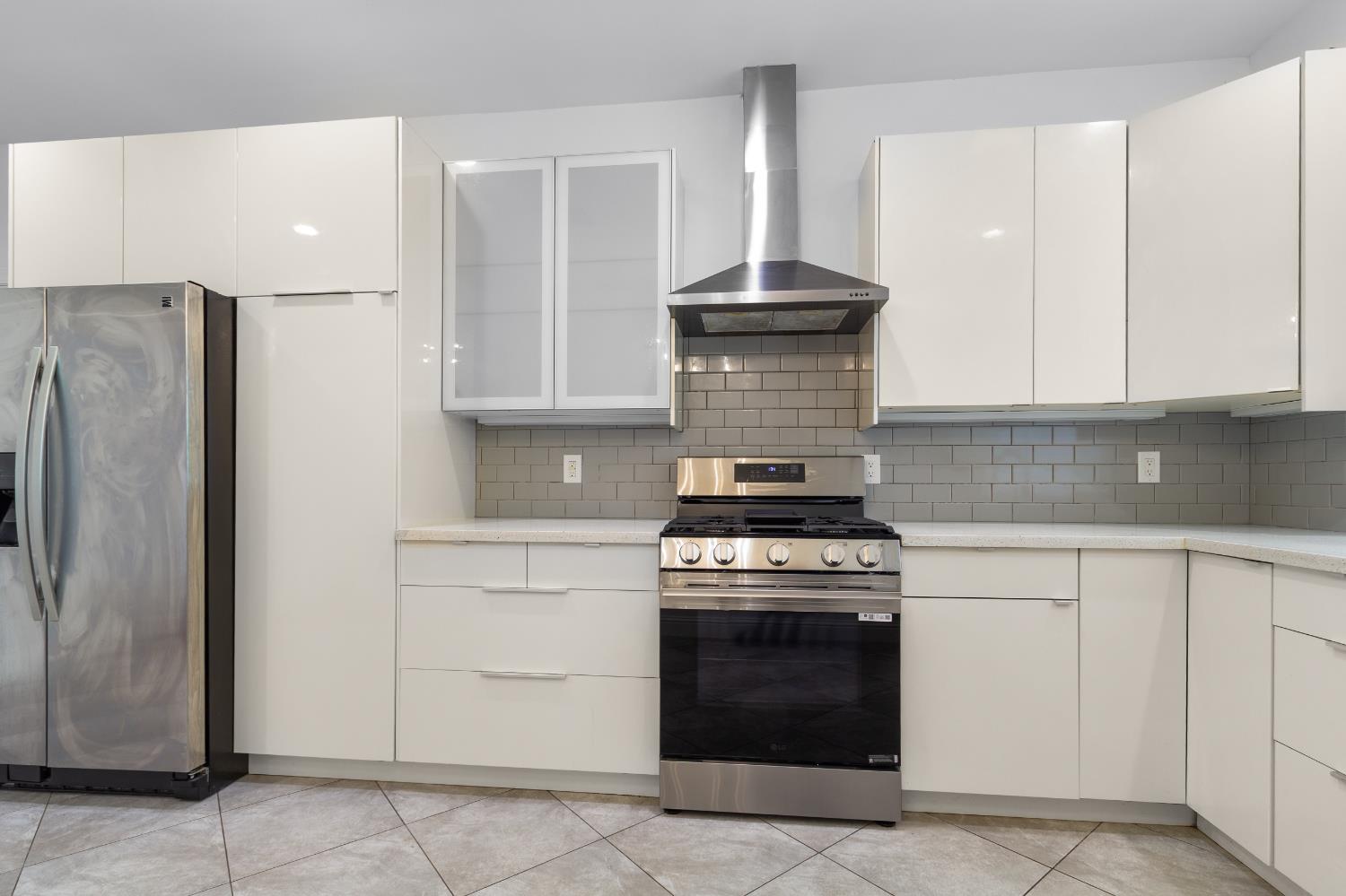 6404 Sylvan Road Citrus Heights, CA 95610 - Photo 7 of 20 a kitchen with stainless steel appliances granite countertop a stove and a refrigerator