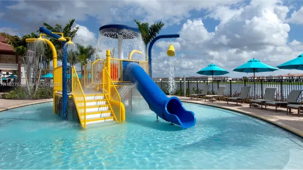 a swimming pool with outdoor seating and yard