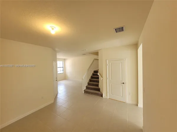 a view of an entryway with stairs