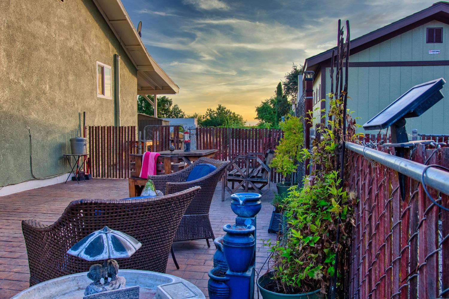 1639 Alpine Road Stockton, CA 95215 - Photo 12 of 96 a table and chairs in the patio with potted plants