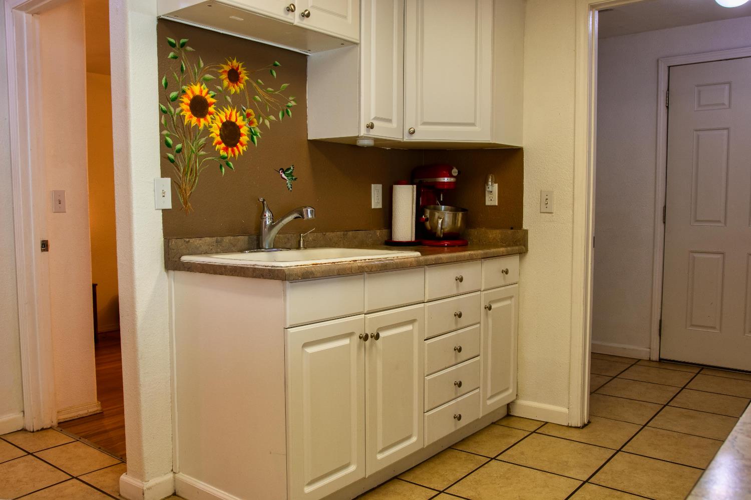 1639 Alpine Road Stockton, CA 95215 - Photo 54 of 96 a bathroom with a sink and mirror
