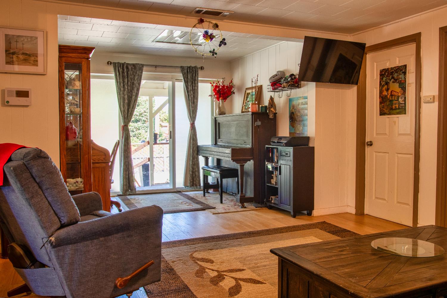 1639 Alpine Road Stockton, CA 95215 - Photo 64 of 96 a living room with furniture a dining table and a refrigerator