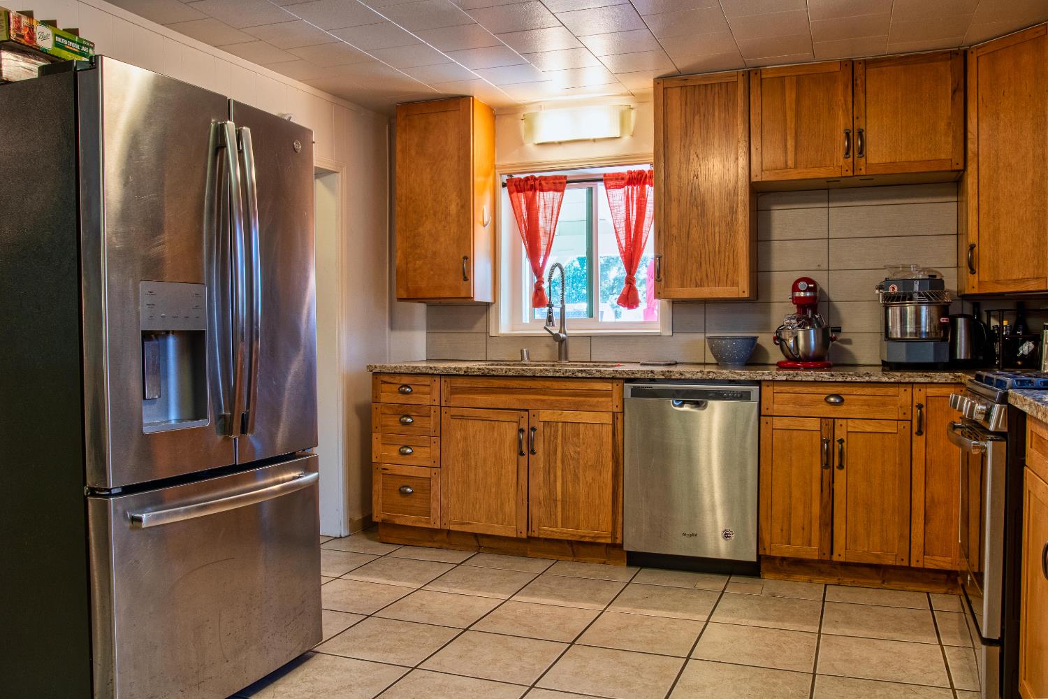 1639 Alpine Road Stockton, CA 95215 - Photo 68 of 96 a kitchen with stainless steel appliances granite countertop a refrigerator and a sink