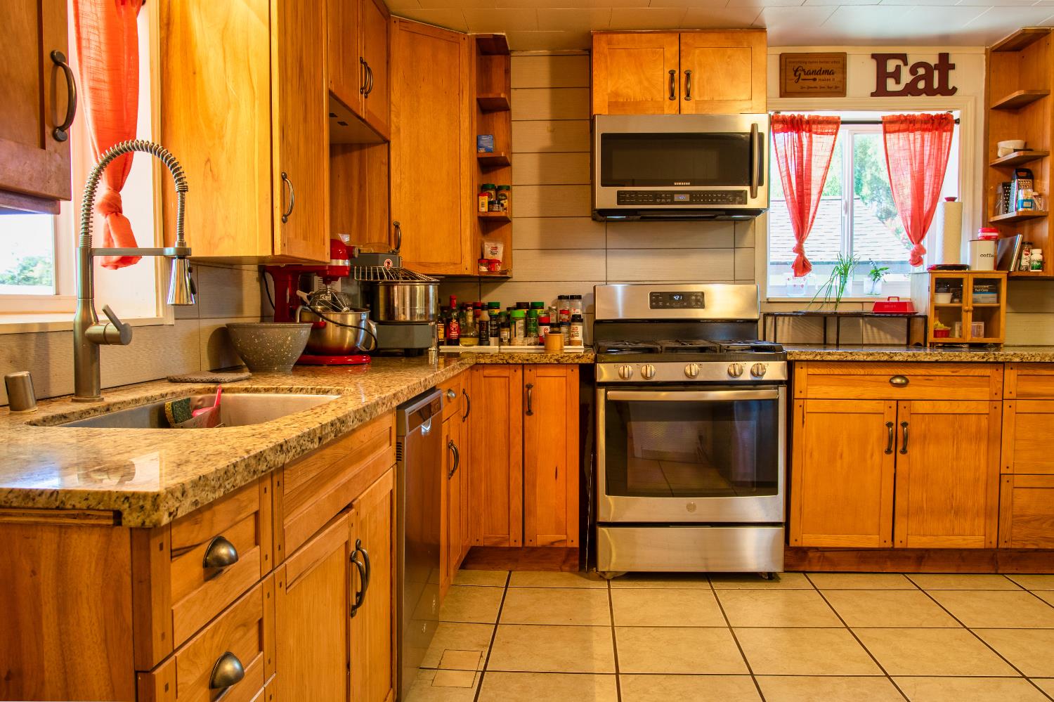 1639 Alpine Road Stockton, CA 95215 - Photo 70 of 96 a kitchen with stainless steel appliances granite countertop a stove and a sink