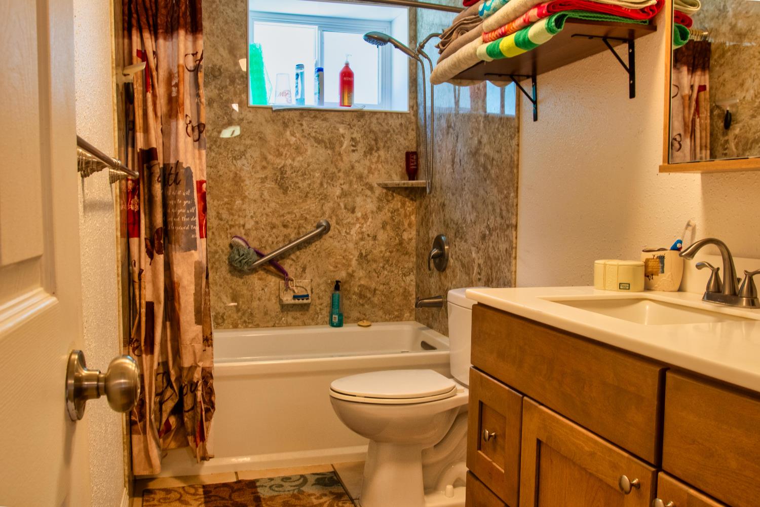 1639 Alpine Road Stockton, CA 95215 - Photo 74 of 96 a bathroom with a sink toilet and shower