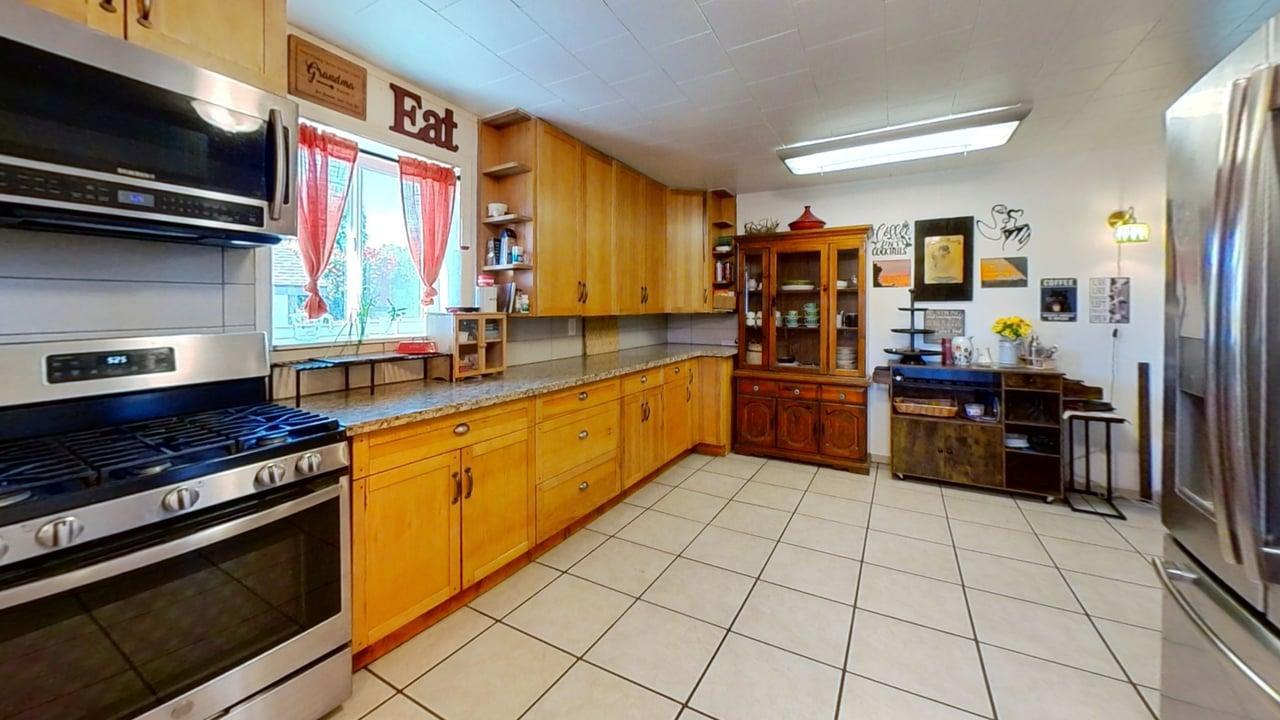 1639 Alpine Road Stockton, CA 95215 - Photo 85 of 96 a kitchen with stainless steel appliances a stove and a refrigerator