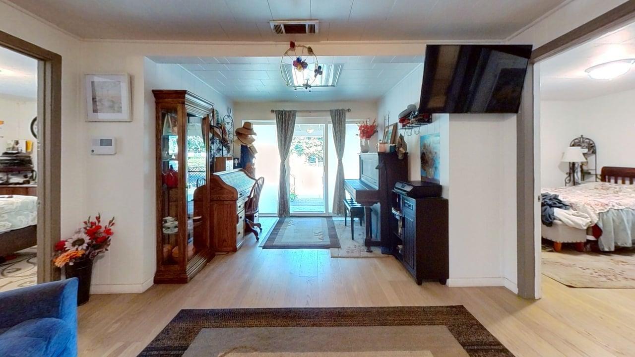 1639 Alpine Road Stockton, CA 95215 - Photo 89 of 96 a view of a hallway with furniture and a livingroom