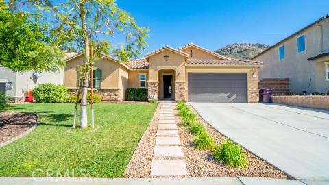 20636 Spring Street Riverside, CA 92507 - Photo 1 of 9 a front view of a house with a yard and garden