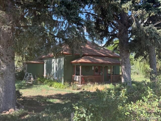 3608 Southeast Frontage Road Johnstown, CO 80534 - Photo 1 of 19 a front view of house with yard and green space