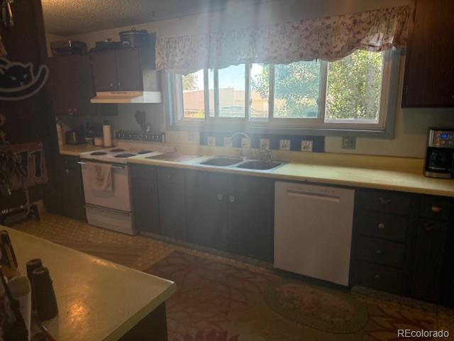 3608 Southeast Frontage Road Johnstown, CO 80534 - Photo 14 of 19 a kitchen with sink cabinets and window