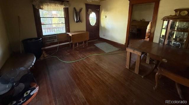 3608 Southeast Frontage Road Johnstown, CO 80534 - Photo 18 of 19 a room with wooden floor and furniture