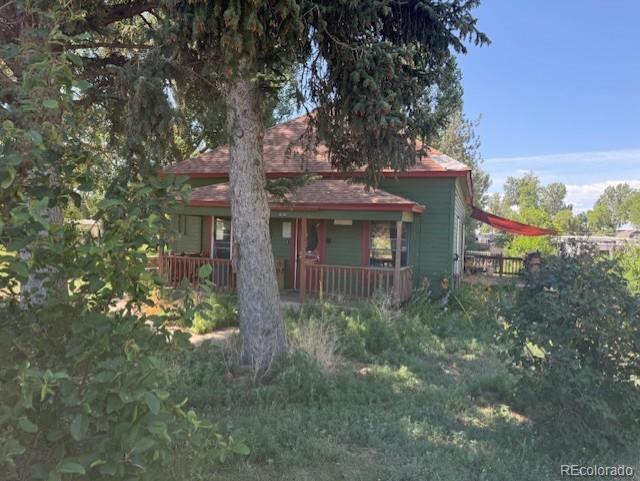 3608 Southeast Frontage Road Johnstown, CO 80534 - Photo 2 of 19 a view of a house with a tree