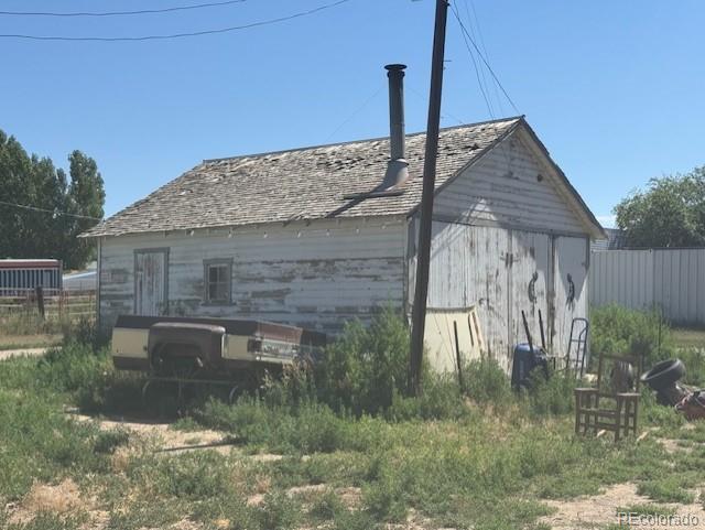 3608 Southeast Frontage Road Johnstown, CO 80534 - Photo 10 of 19 a backyard of a house with lots of green space