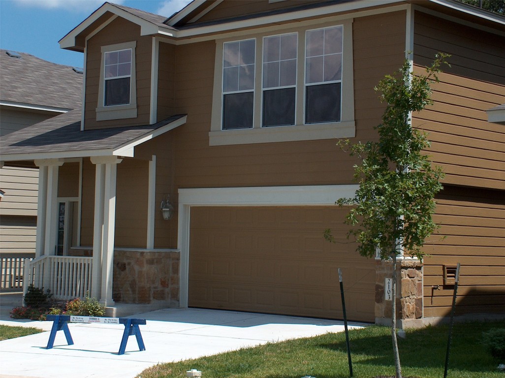 a view of a building with a yard