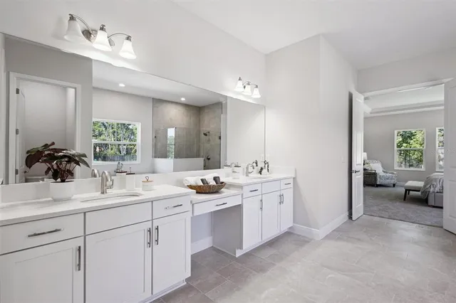 a bathroom with a double vanity sink and mirror