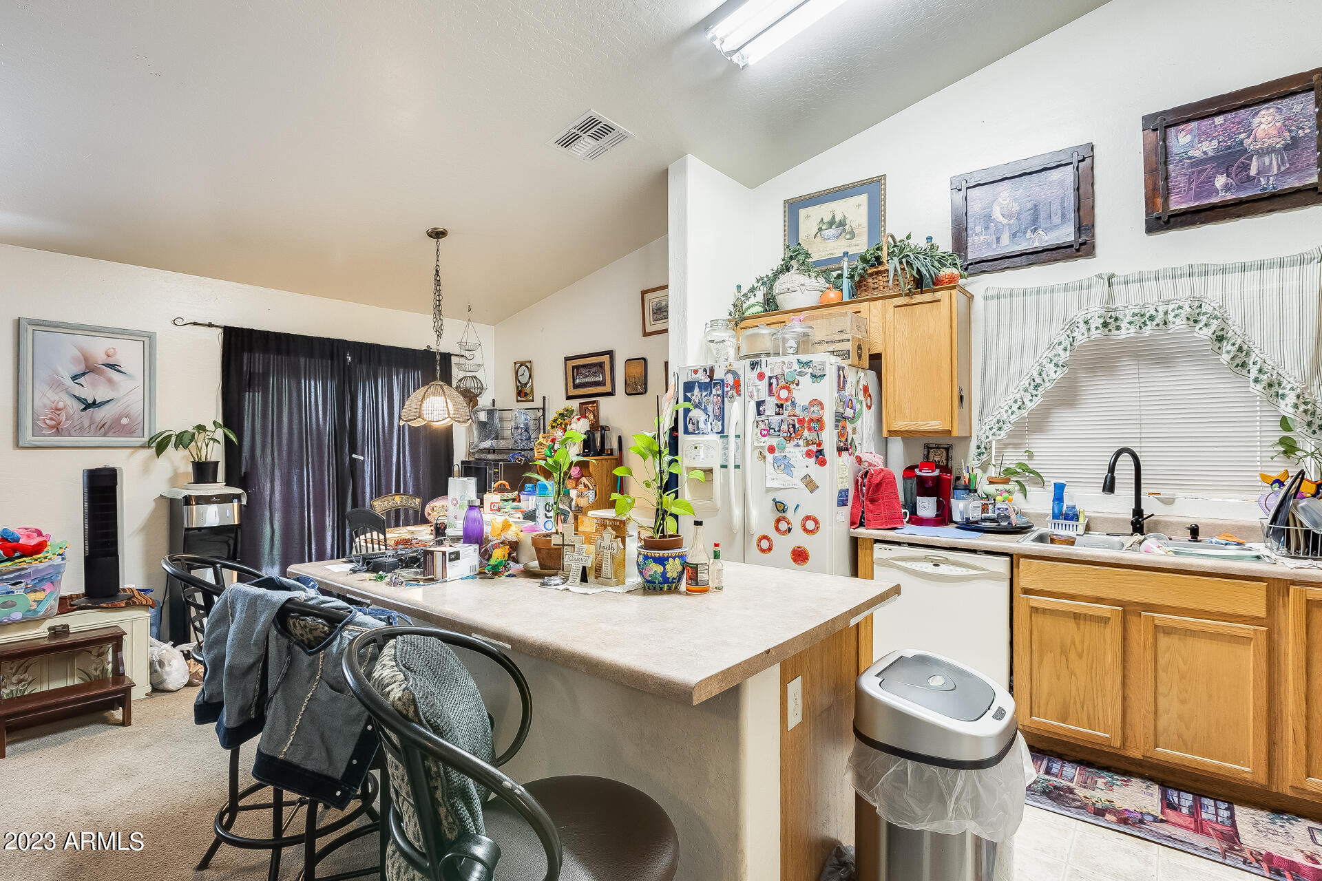 12722 West Boca Raton Road El Mirage, AZ 85335 - Photo 11 of 36 a view of a kitchen with dining table and chairs