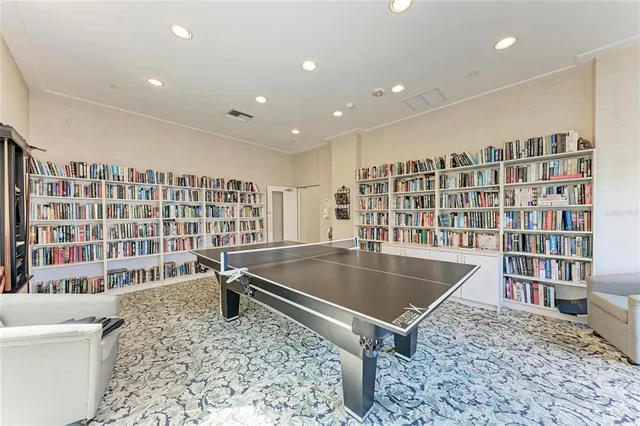 a view of kitchen with a sink and refrigerator