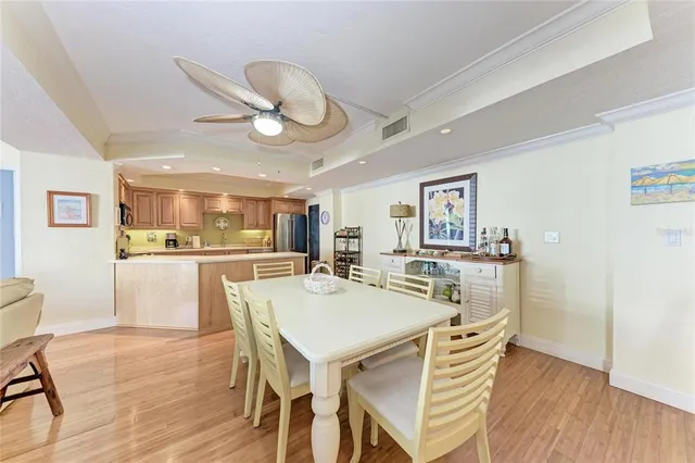 a view of a dining room with furniture and wooden floor