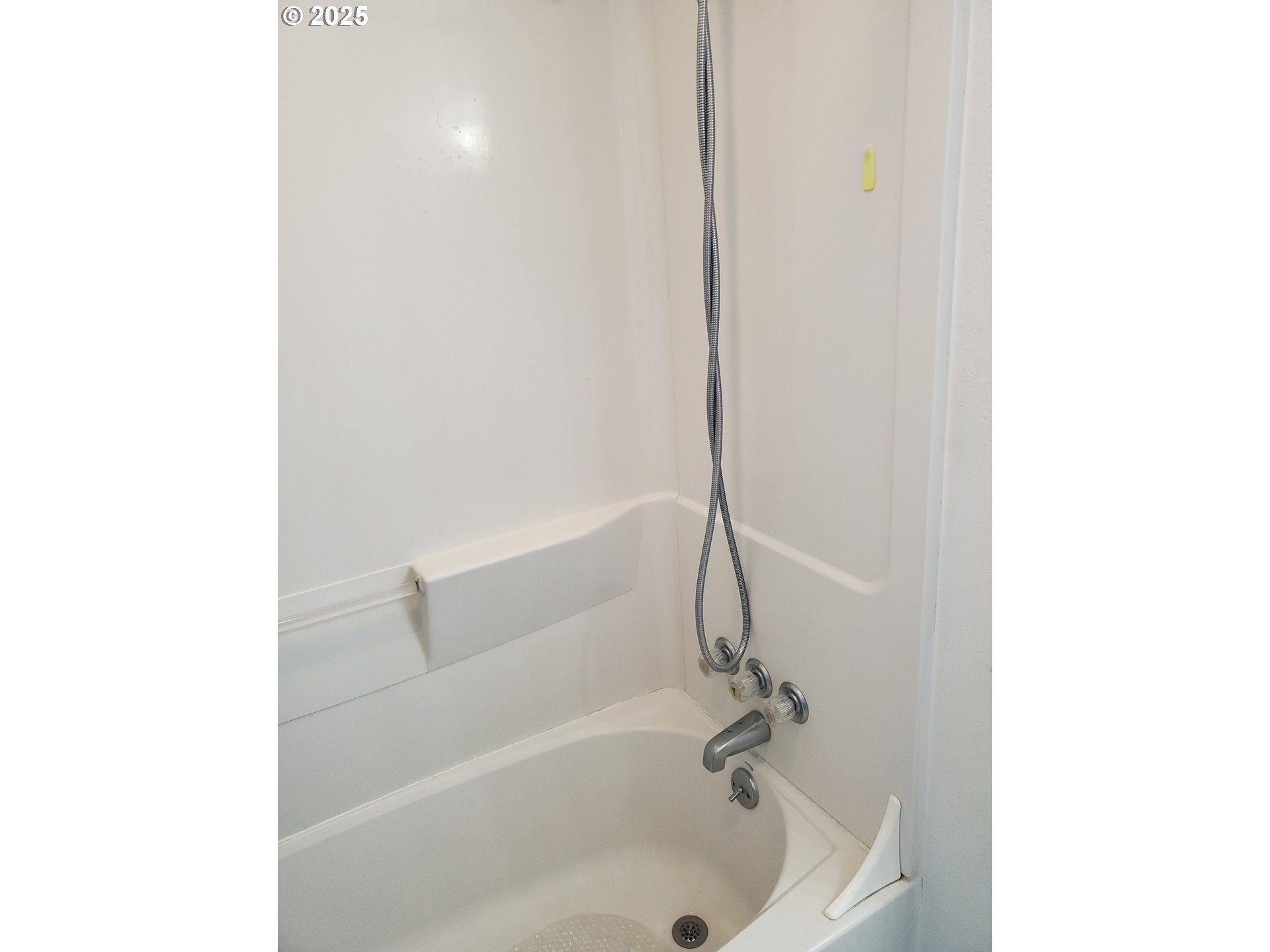 2075 Johnson Street North Bend, OR 97459 - Photo 16 of 20 a white bath tub sitting next to a white sink