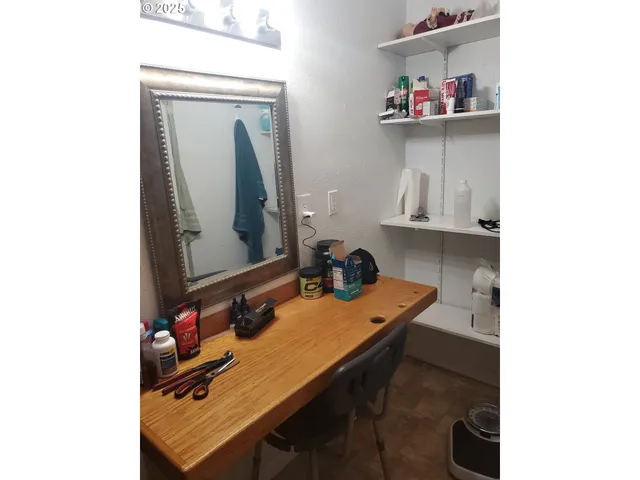 a room with a table and cabinets