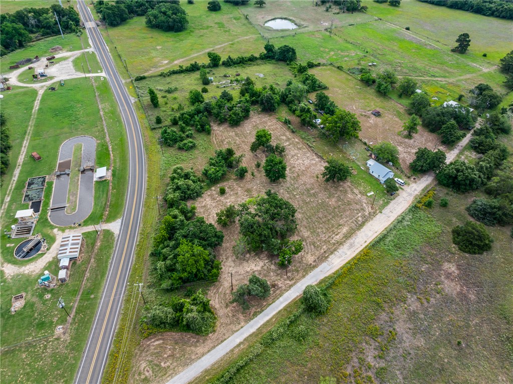 167 Signal Street Somerville, TX 77879 - Photo 10 of 12 an aerial view of a residential houses with outdoor space and street view