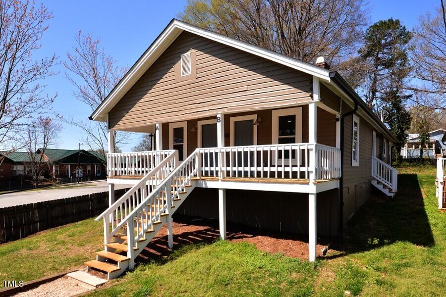 1032 Cornell Street, Unit B Durham, NC 27707 - Photo 3 of 10 a view of a house with a yard and furniture