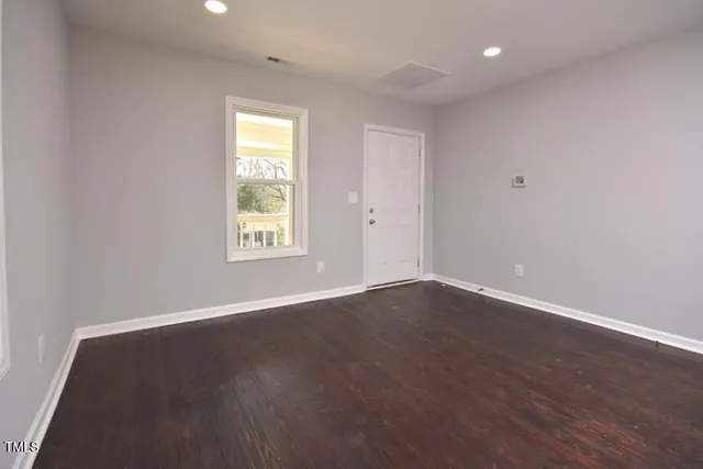 a kitchen with cabinets wooden floor and a sink