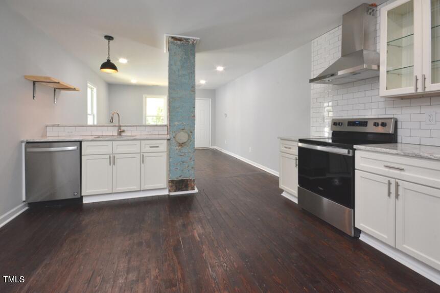 1032 Cornell Street, Unit B Durham, NC 27707 - Photo 5 of 10 a kitchen with cabinets wooden floor and a sink