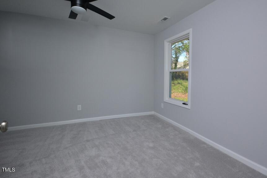 1032 Cornell Street, Unit B Durham, NC 27707 - Photo 10 of 10 an empty room with windows