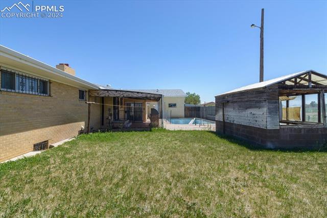 28018 County Farm Road Pueblo, CO 81006 - Photo 46 of 50 View of yard featuring a fenced in pool