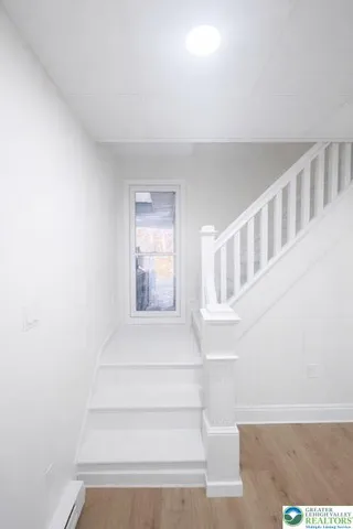 a view of staircase with white walls