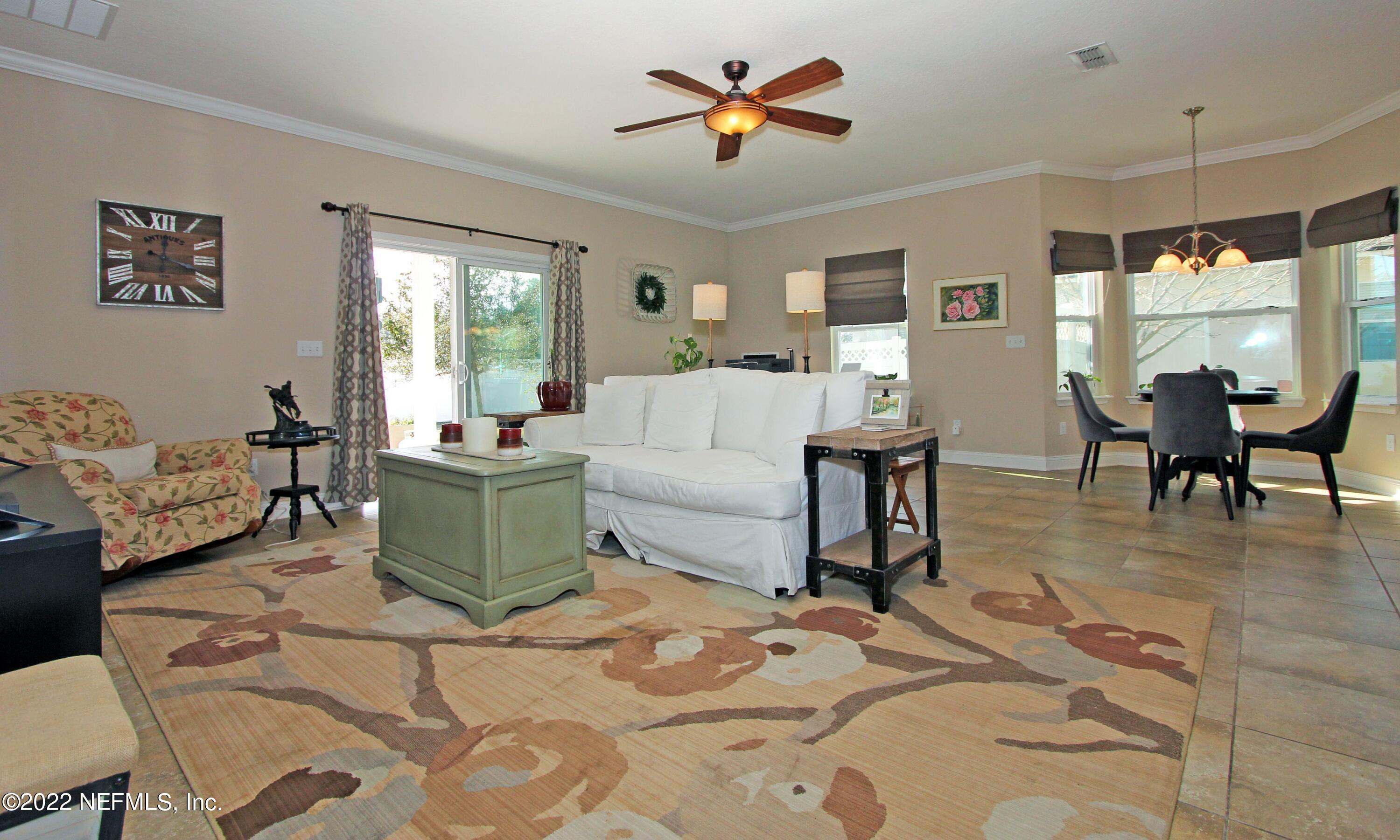 404 Paisley Place St. Johns, FL 32259 - Photo 18 of 42 a living room with furniture and a large window
